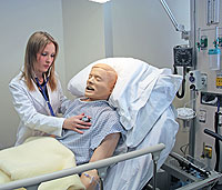 Woman with medical dummy