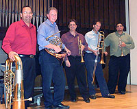 People holding brass instruments