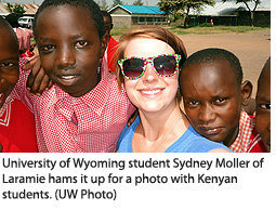 University of Wyoming student Sydney Moller of Laramie hams it up for a photo with Kenyan students. 