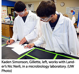 Kaden Simonson, Gillette, left, works with Lander’s Nic Nerli, in a microbiology laboratory.
