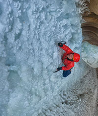 man ice climbing