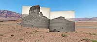 desert and rock scene with camper and black and white inlaid photos