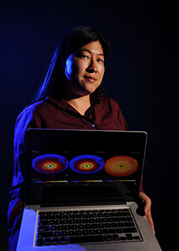 woman holding open laptop