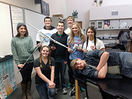 group of students posing in a science lab