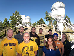 group of people standing in front of observatory