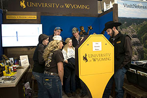 people looking at things at a UW booth