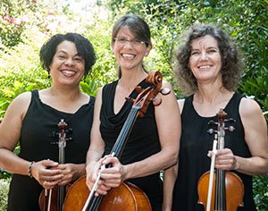 three women holding string instruments