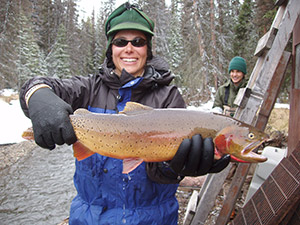 person holding up a large trout