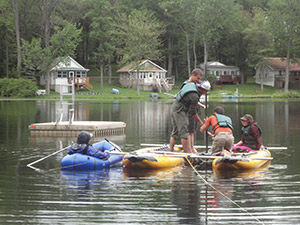 people in boats in a lake