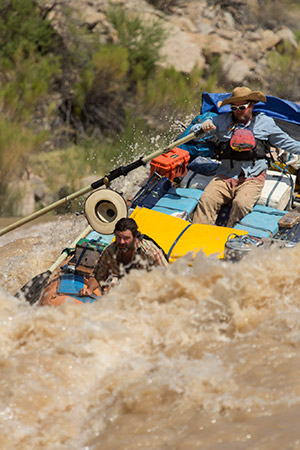 two people white-water rafting