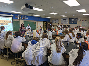 classroom full of people in lab coats