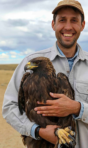 man holding an eagle