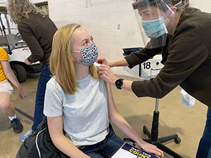 student receiving vaccine