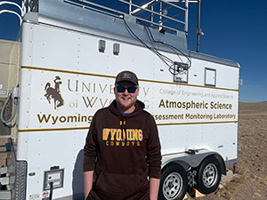man standing in front of a research vehicle
