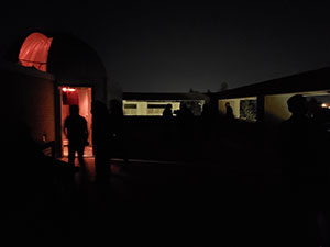 night photo of lit windows from outside