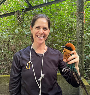 woman holding a bird