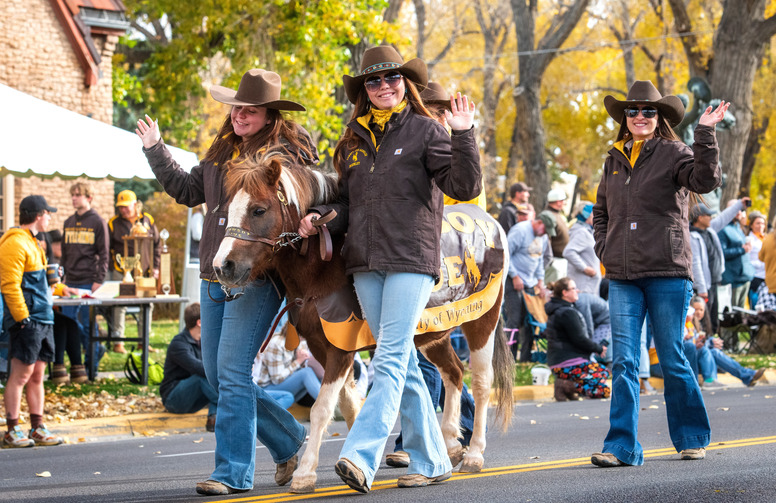 cowboy joe and his handlers in a parade