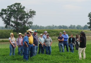group of people listening to an educator