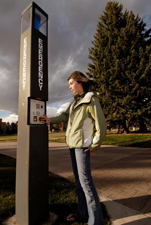 A UW Student Uses an Emergency Call Box.  