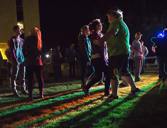 people at an outdoor night gathering