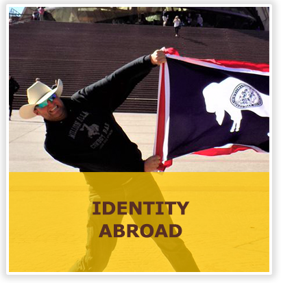 Identity abroad with picture of student holding wyoming flag