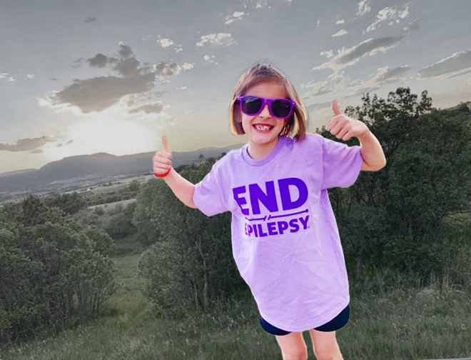 girl doing a thumbs up with a tshirt that says End Epilepsy