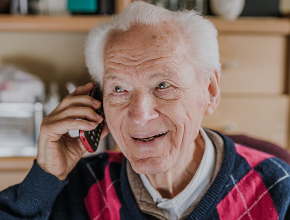 senior citizen using a phone