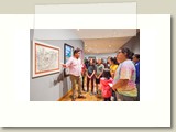 guide tells participants about Art Museum paintings