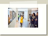 participant examines Art Museum paintings