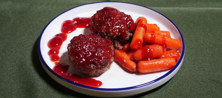 meatloaf and carrots on a plate