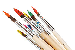 Eight paint brushes of various sizes with different colored paints.