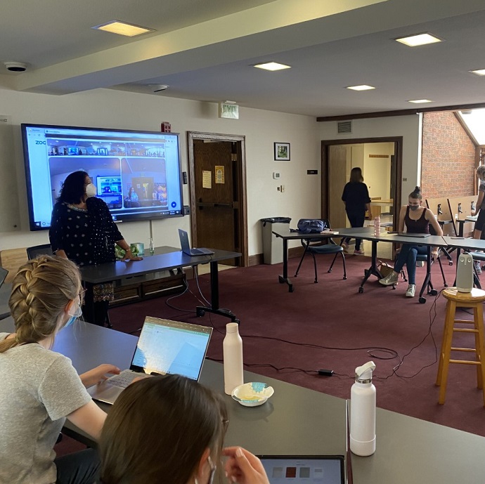 Bharti Qureshi teaching in front of a group of students