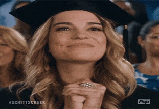 Girl in graduation cap celebrating