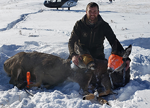 person with two deer