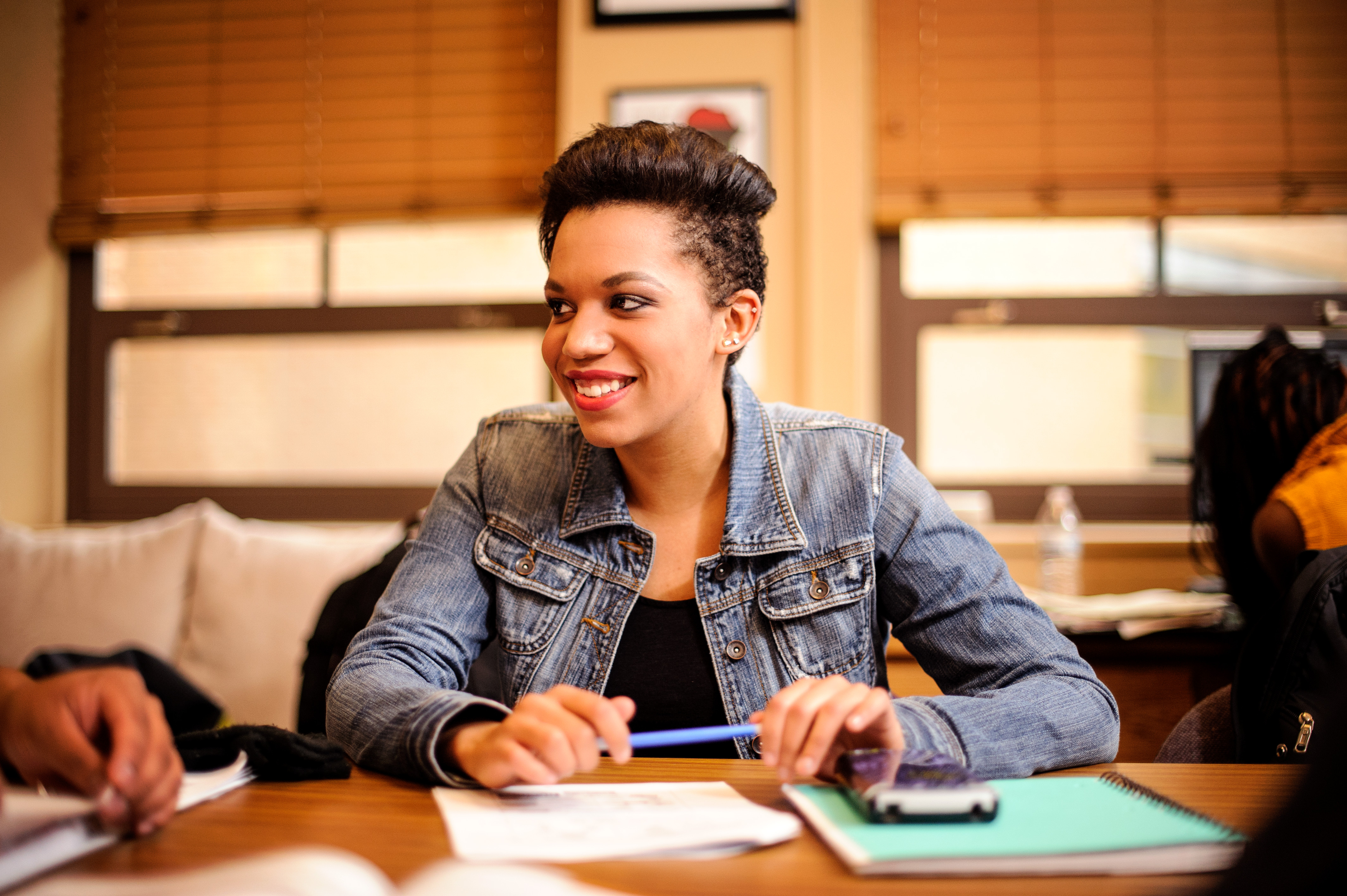 student sitting at a desk with a paper