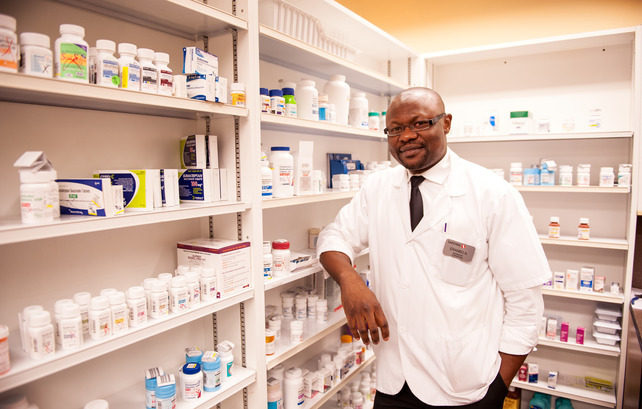A pharmacist standing in a Safeway pharmacy