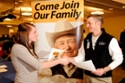 student and employer speaking at a job fair