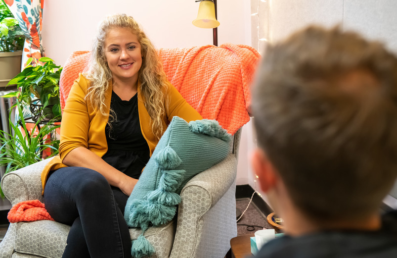 UW counselor speaking with a student in her office in Knight Hall