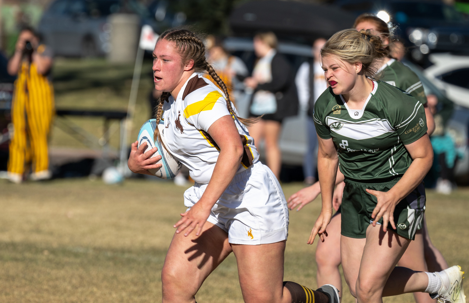 UW Womens Rugby team player running with the ball