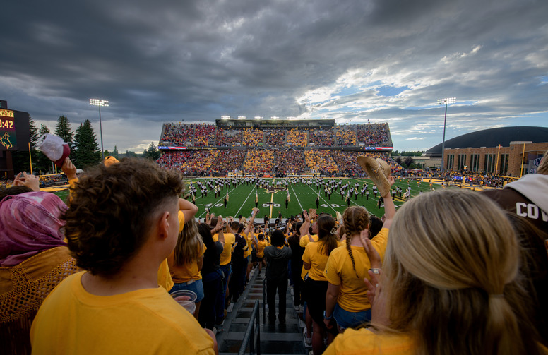 Students at a Cowboys game in War Memorial Stadium
