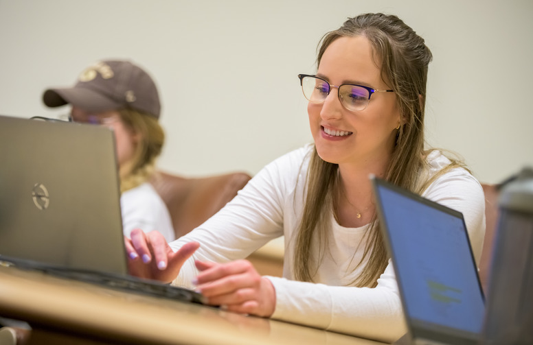 student working on a laptop