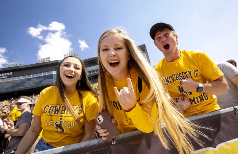 Shelbey and her friends cheering on the Cowboys