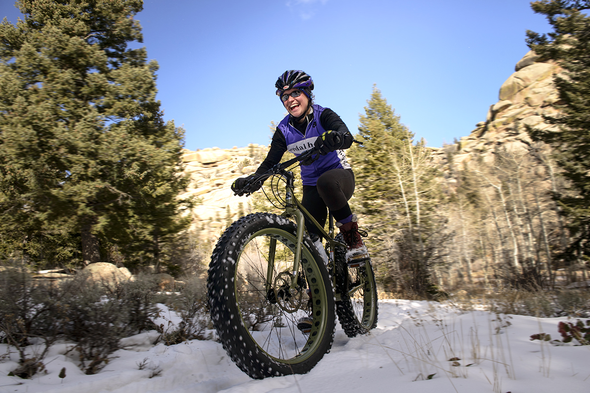 UW student riding a mountain bike with oversized tires