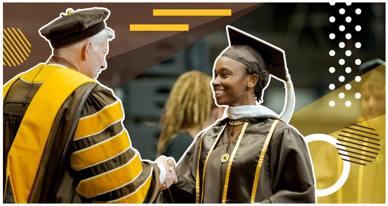 Two people shake hands at a UW commencement ceremony.