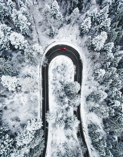 Car on winding winter road