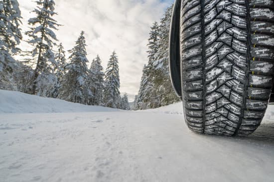 Car with winter tires on snowy road