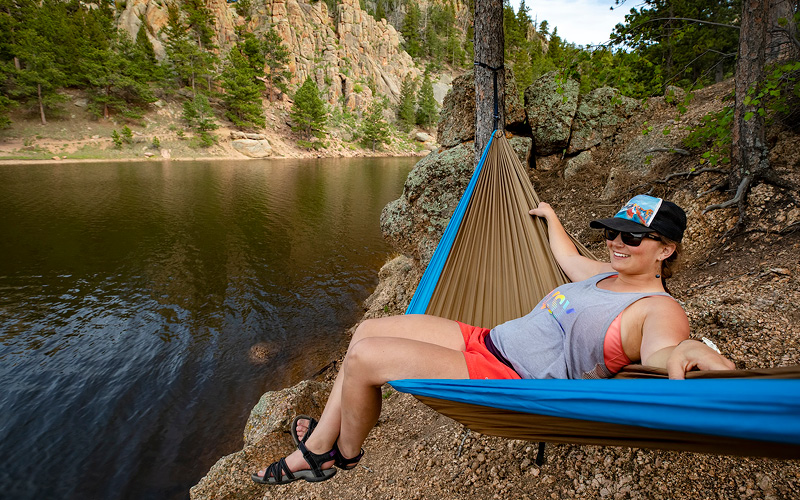 Female student enjoying outdoors in hammock