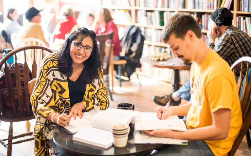 Students studying in downtown coffee shop