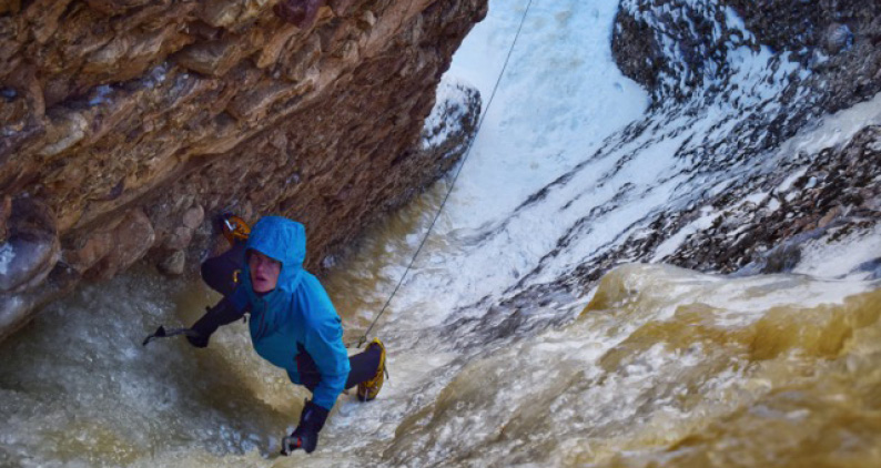 A student climbing ice