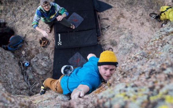 Lasko climbing with a friend